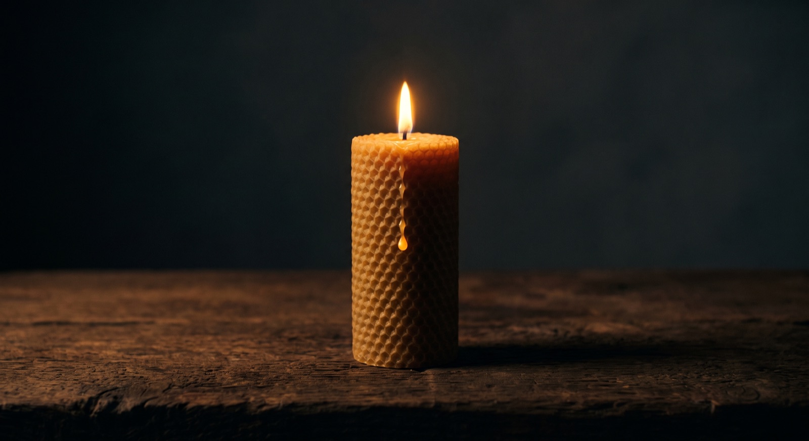 The candle, lit